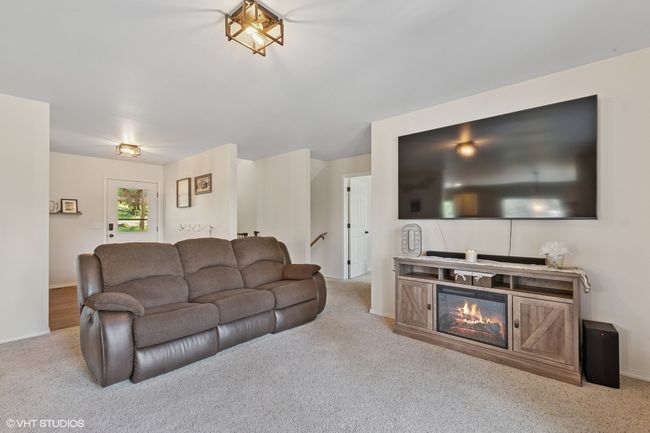Living room featuring carpet floors and baseboards | Image 11