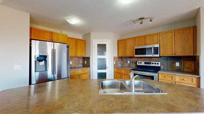 334 Grosbeak Way, House other with 5 bedrooms, 4 bathrooms and 2 parking in Fort Mcmurray AB | Image 6