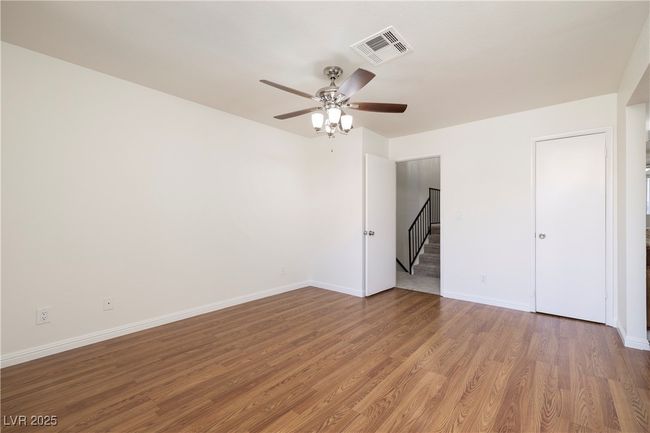 Unfurnished bedroom featuring wood finished floors and ceiling fan | Image 9