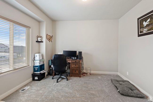 Carpeted office with visible vents and baseboards | Image 18