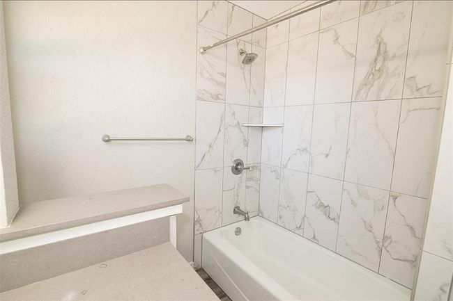 Bathroom featuring shower / tub combination | Image 11