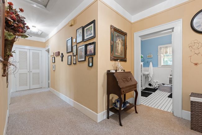Hall featuring carpet floors and baseboards | Image 18