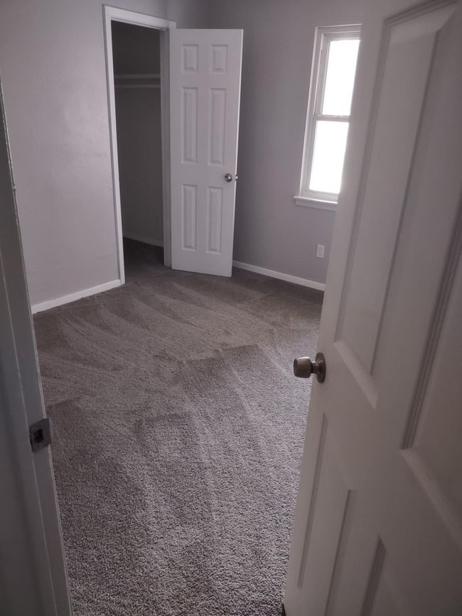 Unfurnished bedroom featuring carpet and a closet | Image 9