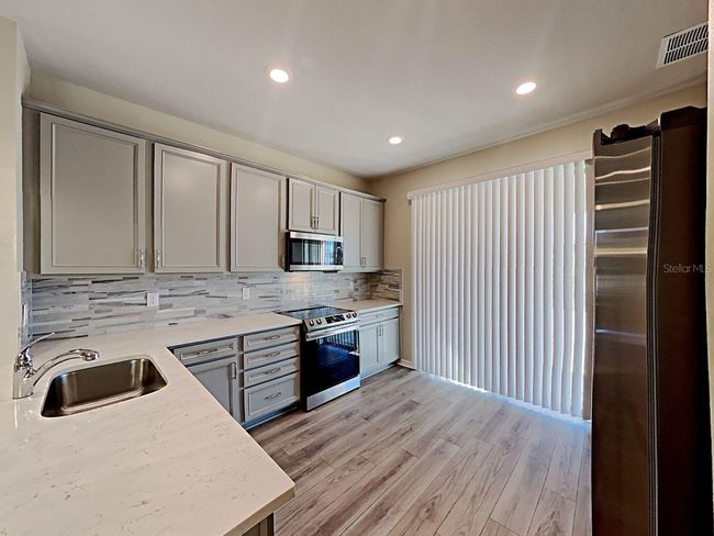 7603 Pool Compass Loop, House other with 4 bedrooms, 3 bathrooms and null parking in Wesley Chapel FL | Image 5