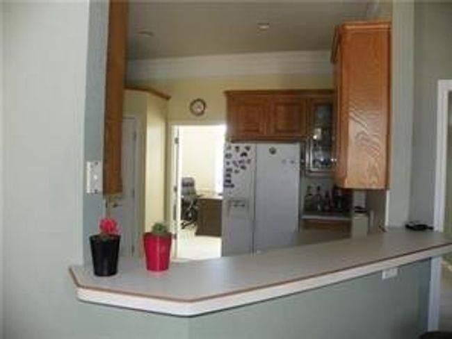 Eat up area at kitchen . White frig included. | Image 4