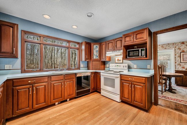 Gorgeous picture window in kitchen and convenient adjacent dining room | Image 11