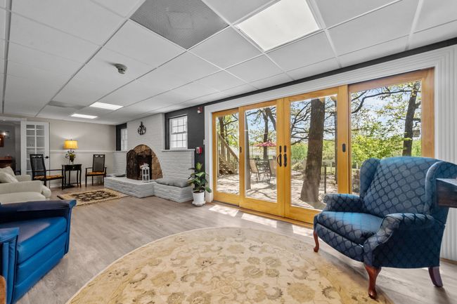 Living area featuring wood finished floors, french doors, and a paneled ceiling | Image 5