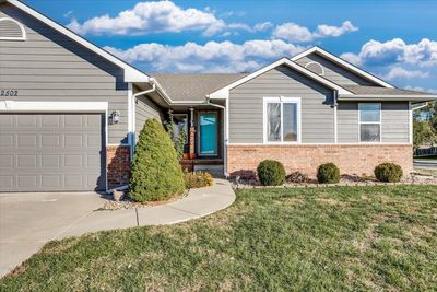 View of front of house with a front lawn and a garage | Image 2