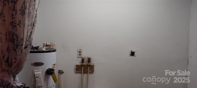 laundry space and water heater | Image 17