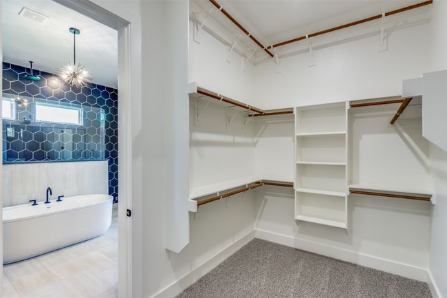 Spacious closet featuring visible vents | Image 17