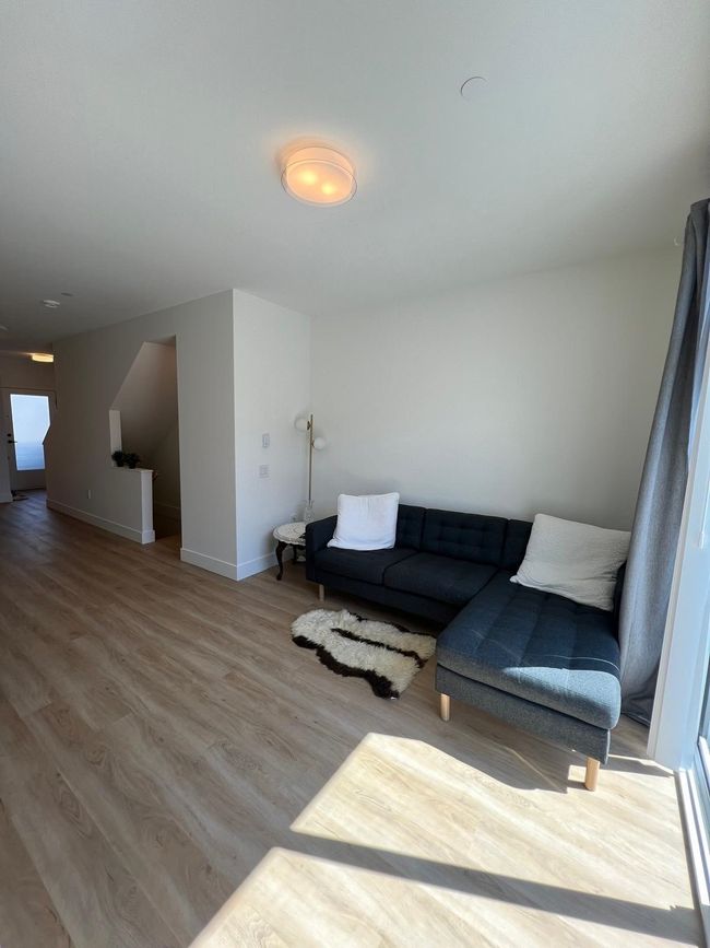 Living area featuring baseboards and wood finished floors | Image 23