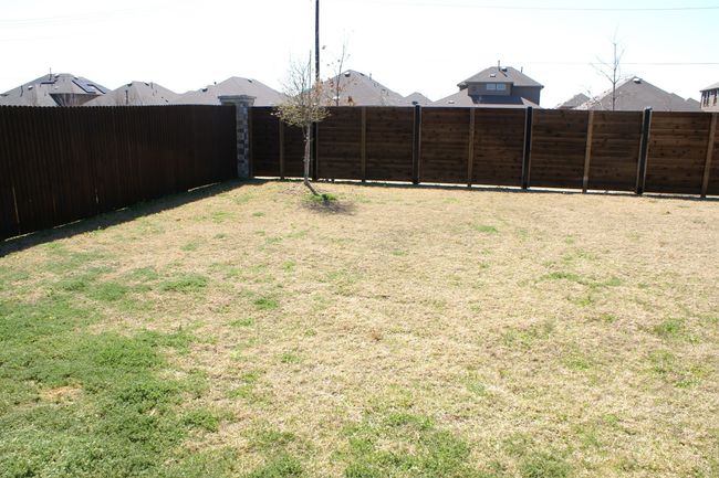 View of yard with a fenced backyard | Image 18