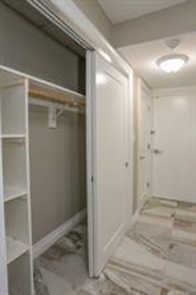 Each suite has two closets. There is one closet open here and a single closet closer to the entrance door. | Image 5