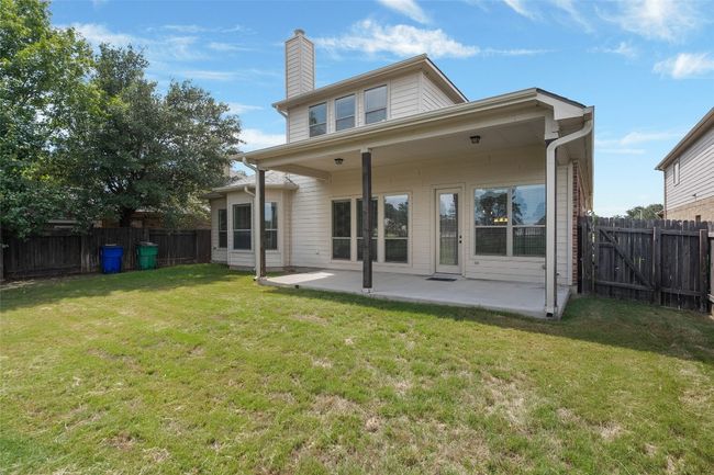 Back of property featuring a patio area, a fenced backyard, and a chimney | Image 38