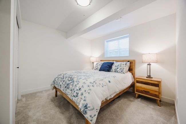 Bedroom with baseboards and carpet | Image 31
