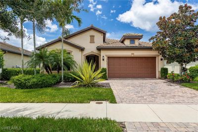 Front of home with 2-car garage and paved driveway | Image 1