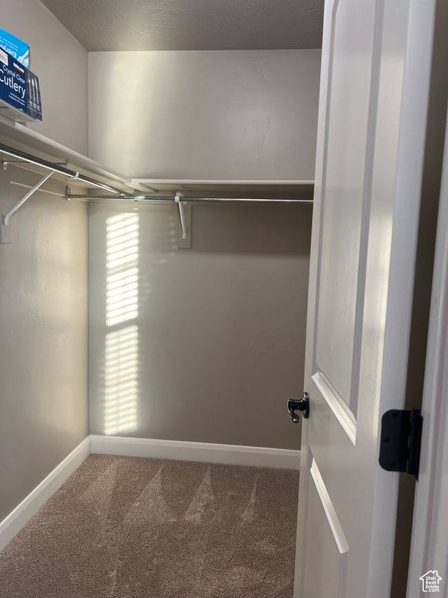 Spacious closet with carpet floors | Image 45