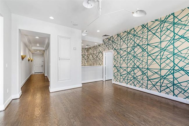 View of formal entry with sconce lighting. | Image 6