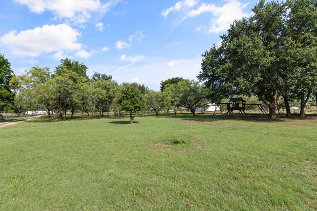 View of community featuring a lawn | Image 31