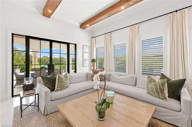 Living room with beam ceiling, recessed lighting, a healthy amount of sunlight, and french doors | Image 9