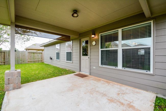 This covered patio is the perfect space for a barbeque. | Image 29