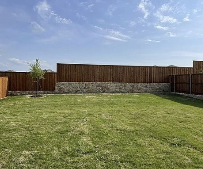 View of fenced backyard | Image 5