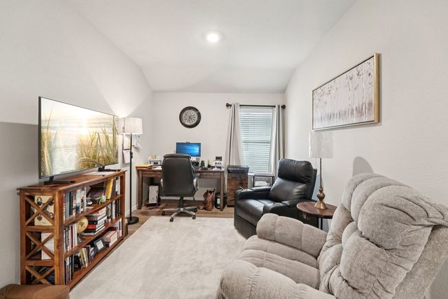 Home office featuring lofted ceiling and wood finished floors | Image 19