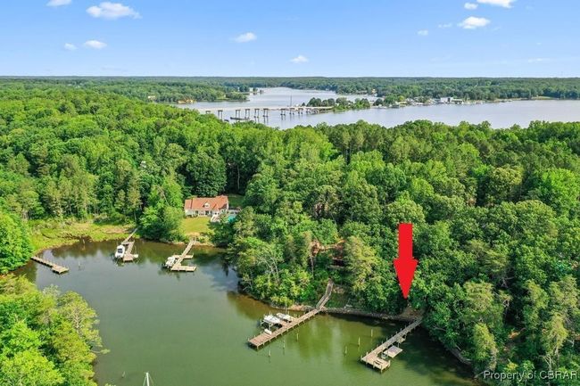 View of property location featuring a heavily wooded area and a large body of water | Image 10