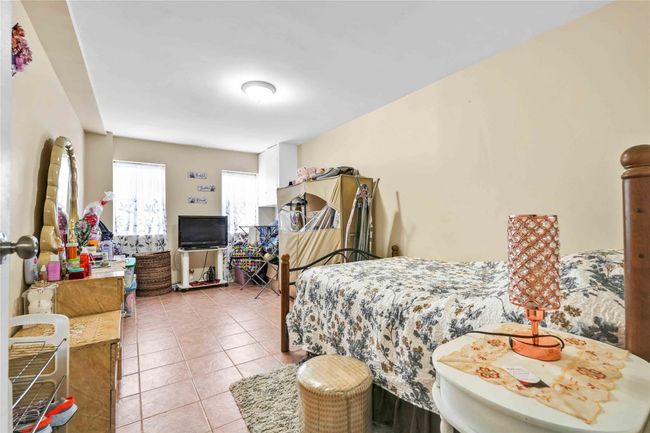 Bedroom featuring light tile patterned floors | Image 17