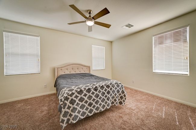 Bedroom featuring carpet flooring and a ceiling fan | Image 19
