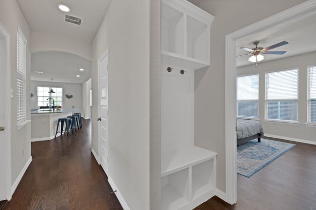 Mudroom with dark wood finished floors, recessed lighting, ceiling fan, and visible vents | Image 18