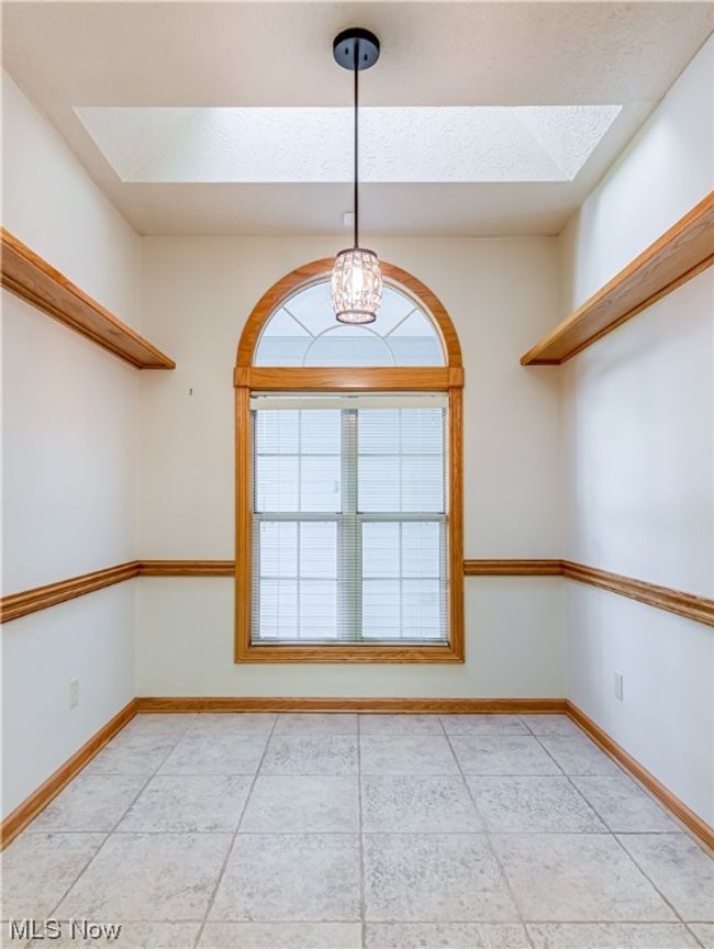 View of tiled spare room | Image 18