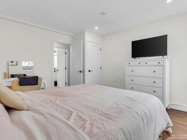 Extra large, bright beautiful bedroom with all new flooring, closet with shelving system, new doors, and new south facing window. | Image 34