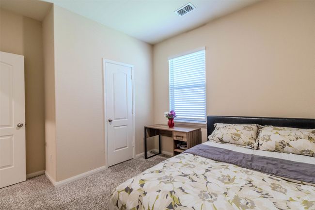 Bedroom with light carpet | Image 18