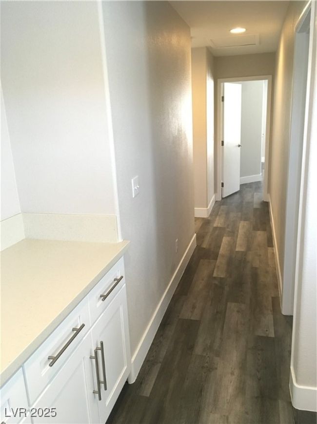 Hall featuring dark wood-style floors and baseboards | Image 15