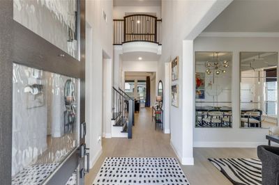 Two story foyer entrance with wood floors. | Image 3