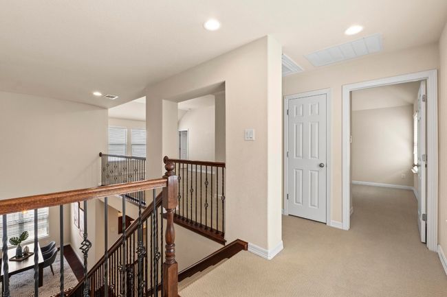 Hallway with an upstairs landing, light carpet, and recessed lighting | Image 27