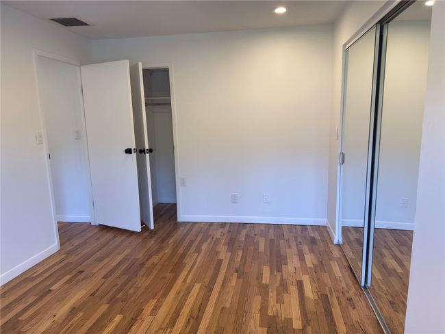 Unfurnished bedroom featuring recessed lighting, wood finished floors, and baseboards | Image 18