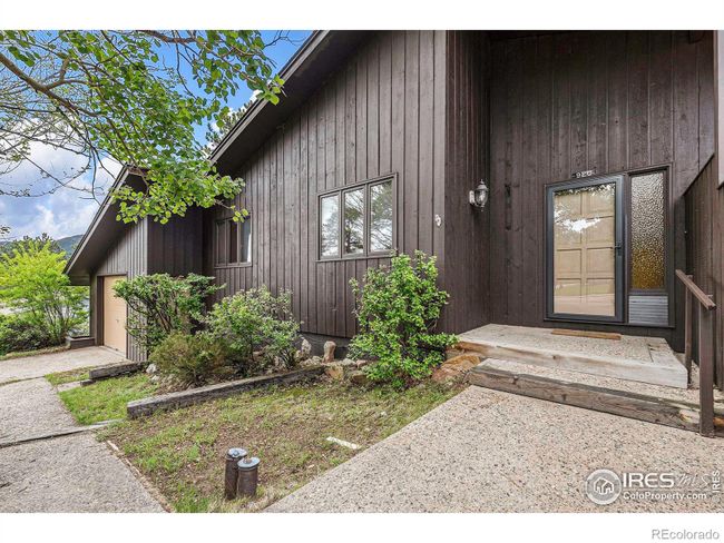 Entry to 3 bedroom side. Each Unit has a 1 car attached Garage with an additional Detached Garage on West Side | Image 5