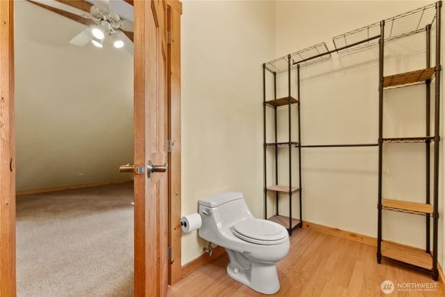 Spacious half bathroom with potential to add a shower and create a full bath. | Image 35