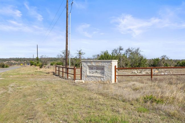 Community / neighborhood sign with a rural view and fence | Image 34