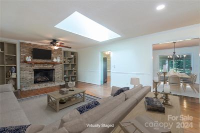 Large family room with gas fireplace and skylight *virtually staged* | Image 3