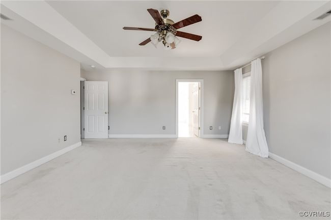 Primary bedroom opposite view with view of bathroom | Image 28
