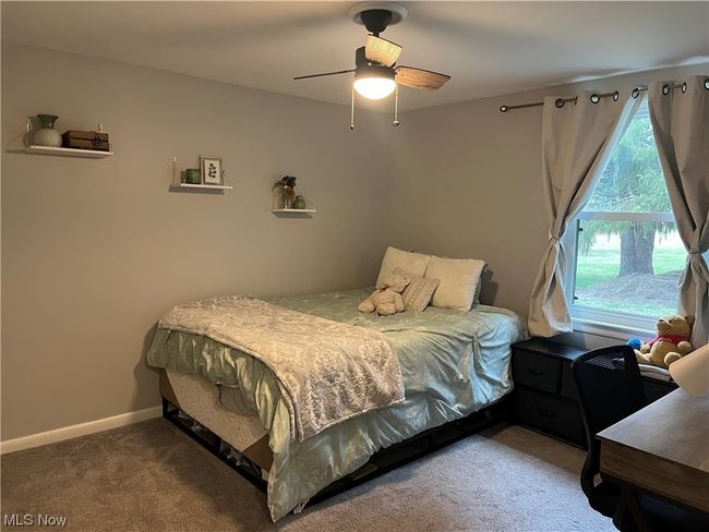 Carpeted bedroom featuring ceiling fan | Image 15
