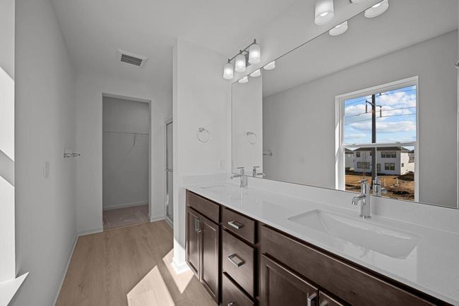 Owner's Bath with comfort height vanity and double sinks. | Image 5