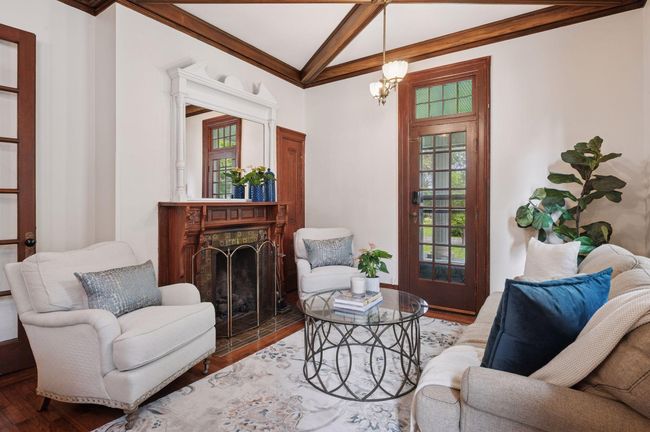 Parlor room with gas fireplace and porch access | Image 15
