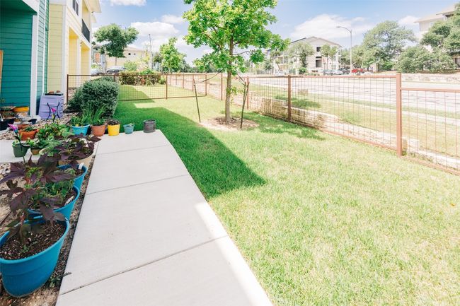 Fenced backyard with a residential view | Image 7