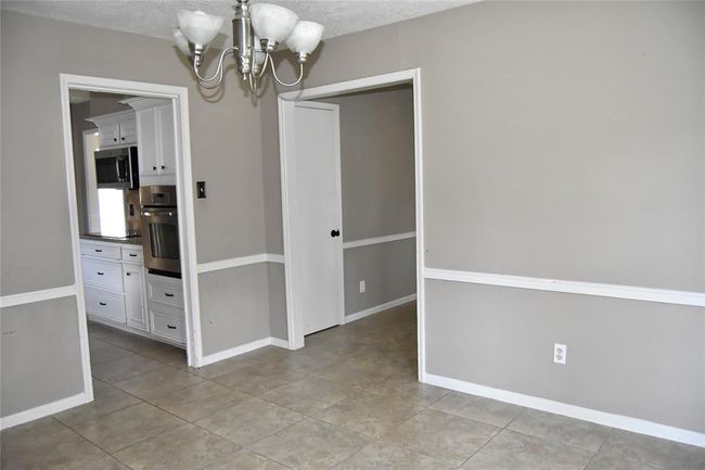 dining room leads to kitchen or living area | Image 13