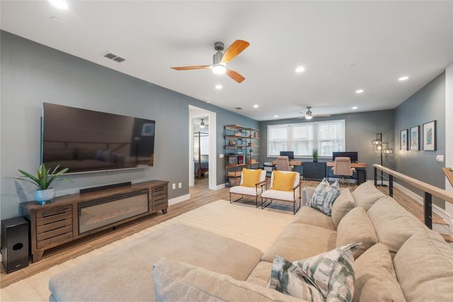 View of family room from outdoor living room / porch. | Image 20