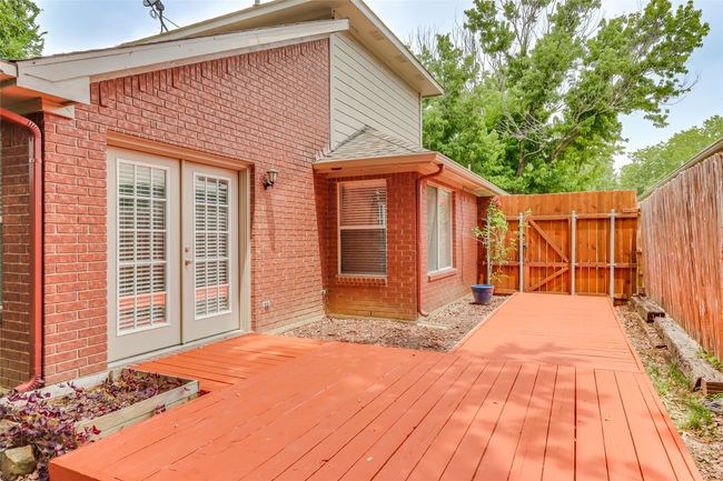 Wooden deck with fence, a gate, and french doors | Image 26